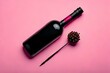 © indofootage - Flat lay mock up diagonal wine bottle isolated on pink background with copy space. Holidays concepts