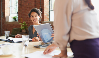 Sticker - Taking the moment to present her ideas as well. Shot of a young businesswoman having a meeting with her colleagues in an office.