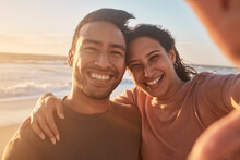 Portrait Of A Young Diverse Biracial Couple Taking A Selfie At The Beach And Having Fun Outside. Portrait Of A Young Diverse Biracial Couple Taking A Selfie At The Beach And Having Fun Outside.