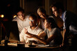 © Nina L/peopleimages.com - Finding ways to get to the results they want. Shot of a group of businesspeople working together on a computer in an office at night.