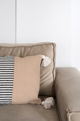 Wall Mural - Cropped shot of grey comfortable armchair with cushions on the seat in living room