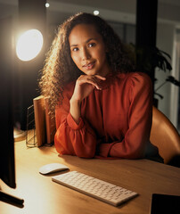 Poster - Success all depends on how badly you want it. Portrait of a confident young businesswoman sitting at a desk while working in an office at night.