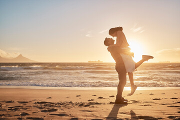 Poster - Young diverse biracial couple having fun at the beach together. Young diverse biracial couple having fun at the beach together.