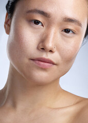 Poster - The eyes are the windows to the soul. Shot of a young woman standing against a grey background.