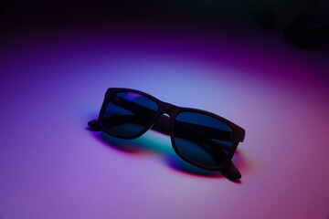 Wall Mural - sunglasses on a dark background