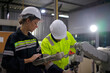 © Suney - Engineer work at robotic arm factory.