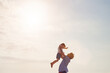 © Bevan G/peopleimages.com - Ill always be here to catch you. Shot of a father lifting his daughter into the air at the beach.