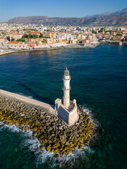 Wall Mural - Aerial view of a lighthouse and the old Venetian harbor in the Greek town of Chania on the island of Crete