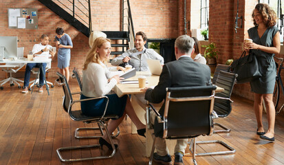Aufkleber - Time to get down to some exciting business. Shot of a group of businesspeople having a meeting in an office.