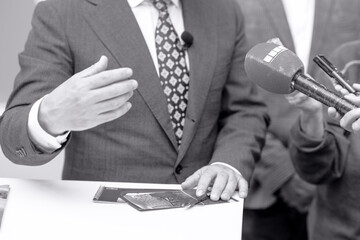 Wall Mural - News or press conference or media interview with business person, digital voice recorder and microphone in focus