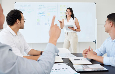 Canvas Print - Please do share your idea with the team. Shot of a young businesswoman leading a meeting with her colleagues in an office.