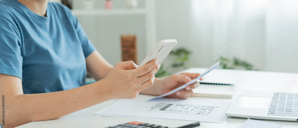 woman use phone scan barcode or QR codes to pay credit card bill after ...