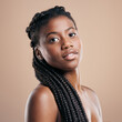 © Siphosethu Fanti/peopleimages.com - My braids are my crown. Cropped portrait of an attractive young woman posing in studio against a brown background.