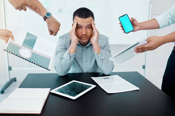 When you just have too much on your plate. Portrait of a young businessman looking stressed out while working in a demanding office environment.