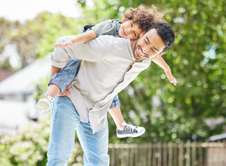 Sticker - Its good to get outside and have some fun. Shot of a father giving his son a piggyback ride outdoors.