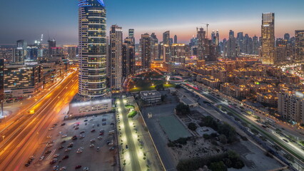 Sticker - Dubai's business bay towers aerial day to night timelapse. Rooftop view of some skyscrapers