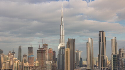 Panoramic skyline of Dubai with business bay and downtown district morning timelapse.