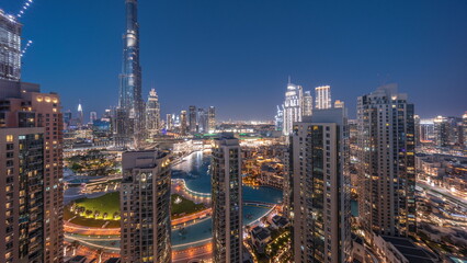 Poster - Dubai Downtown cityscape with tallest skyscrapers around aerial day to night timelapse.