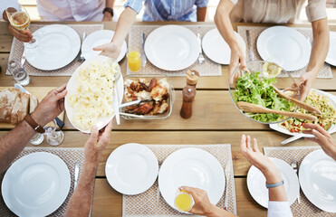 Sticker - We want of everything on the table. Shot of a family enjoying a meal together.