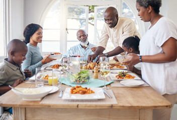 Poster - Families that eat together stay together. Shot of a family having lunch at home.