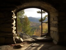 A Landscape Photo Taken Through A Window Frame Or Archway