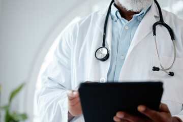 Aufkleber - Diving into some medical research. Closeup shot of an unrecognisable doctor using a digital tablet in a medical office.