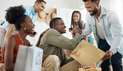 Wall Mural - He always comes through for me. Shot of a young man opening up gifts on his birthday at home.