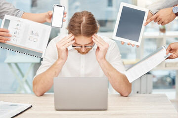 Poster - Please leave me alone for just a minute. Shot of a young businessman looking stressed out in a demanding office environment.
