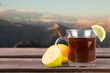 © BillionPhotos.com - Tasty hot tea in cup in the sunrise background.