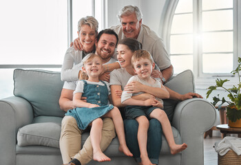 Poster - The memories we make with our family is everything. Shot of a happy family relaxing on the sofa at home.