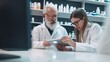 © GustavsMD - Mature pharmacists using a tablet together in a drug store: technology in the pharmacy. Generative AI.