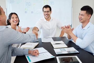 Aufkleber - We are thrilled by this merger. Shot of businesspeople shaking hands during a meeting in an office.