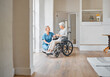 I hope you stay in good spirits. Shot of a nurse caring for a senior woman in a wheelchair in a retirement home.