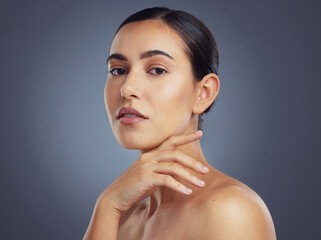 Canvas Print - Im comfortable here. Studio shot of a beautiful young woman posing against a grey background.