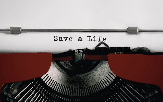 Text Save a Life typed on retro typewriter