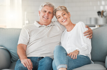 Poster - Were definitely two of a kind. Shot of a happy senior couple relaxing on the sofa at home.