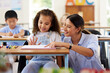 © Nina Lawrenson/peopleimages.com - Learning to share is one of the skills we learn at preschool. Shot of a female teacher assisting a preschool learner in her class.