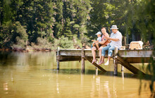 No Matter What Youre Doing, Time Spent Together Is What Matters. Shot Of A Little Boy Fishing With His Father And Grandfather At A Lake In A Forest.