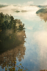 Wall Mural - high angle view of boundary waters lake and trees in morning fog in minnesota during autumn
