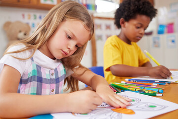 Poster - Equip your little ones with the skills they need in their lives. Shot of preschool students colouring in class.