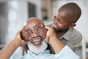 Wall Mural - A happy family is but an earlier heaven. Shot of a boy and his grandpa bonding at home.