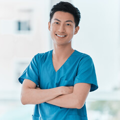 Poster - Its about being capable and compassionate. Portrait of a young doctor standing with his arms crossed in a hospital.