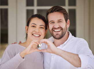 Poster - You call it madness, but I call it love. Shot of a young couple forming a heart shape with their hands while standing outside.