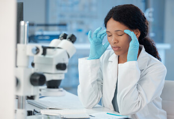Poster - Theres no need for this. Shot of a young lab worker experiencing a headache while at work.