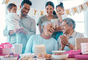 Poster - Laughter and cake. Shot of a family celebrating a birthday together at home.