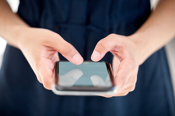 Aufkleber - Connect with everyone around the world. Shot of an unrecognizable businessperson using a phone at work.
