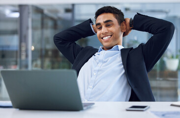 Poster - Ive accomplished all that I set out to do. Shot of a young businessman taking a break while working on a laptop in an office.