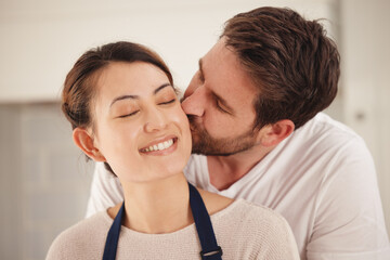Poster - You make me feel loved. Shot of a man kissing his wife on her cheek at home.