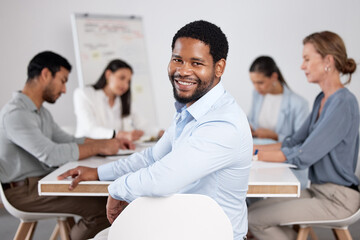 Poster - Its great to be a part of these meetings. Cropped portrait of a handsome young businessman sitting in the boardroom during a meeting with her colleagues.
