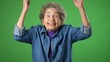 © Robert Peak - Portrait of elderly senior old woman with wrinkled skin and grey hair looks at camera gives mind blown gesture showing explosion of ideas posing isolated on green screen background with copy space.